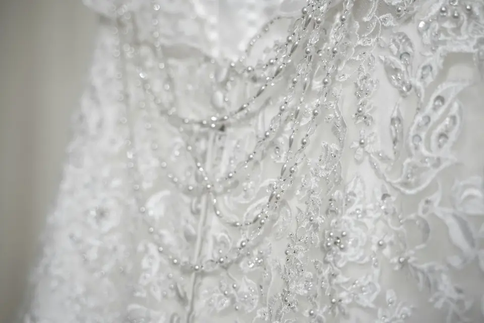 Close view of beaded lace on a wedding gown